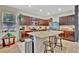 Modern kitchen with stainless steel appliances, granite countertops, dark wood cabinets and island at 3320 Pleasant Willow Ct, Brandon, FL 33511