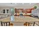 Spacious kitchen with a large island, stainless steel appliances, and beautiful wood cabinetry at 3320 Pleasant Willow Ct, Brandon, FL 33511