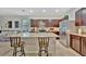 Bright kitchen with stainless steel appliances, granite countertops, dark wood cabinets at 3320 Pleasant Willow Ct, Brandon, FL 33511