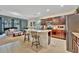 Spacious kitchen with stainless steel appliances, granite countertops, and an island with barstool seating at 3320 Pleasant Willow Ct, Brandon, FL 33511
