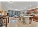 Open-concept kitchen featuring modern appliances, granite countertops, and a functional island with seating at 3320 Pleasant Willow Ct, Brandon, FL 33511