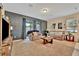 Inviting living room featuring comfortable seating and a sliding glass door leading to outdoor space at 3320 Pleasant Willow Ct, Brandon, FL 33511