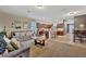 Open-concept living space with a living room, kitchen, and dining area seamlessly connected at 3320 Pleasant Willow Ct, Brandon, FL 33511