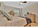 Tranquil main bedroom featuring rustic furniture, soft lighting, and an open view for relaxation at 3320 Pleasant Willow Ct, Brandon, FL 33511