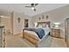 Comfortable main bedroom with a ceiling fan, rustic wood furniture, soft lighting and an open closet space at 3320 Pleasant Willow Ct, Brandon, FL 33511