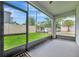 View from screened lanai showcasing a well-maintained lawn and neighborhood street at 3320 Pleasant Willow Ct, Brandon, FL 33511