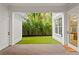 Charming backyard with well-maintained artificial turf and lush tropical landscaping at 334 11Th Ne Ave, St Petersburg, FL 33701