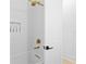 Modern bathroom featuring white subway tile, gold hardware and black door lever at 334 11Th Ne Ave, St Petersburg, FL 33701