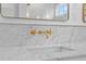 Close up of luxury bathroom featuring marble countertop and golden faucet design at 334 11Th Ne Ave, St Petersburg, FL 33701