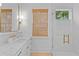 Modern bathroom with marble countertops, gold fixtures, and glass-enclosed shower at 334 11Th Ne Ave, St Petersburg, FL 33701