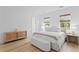Bright bedroom with wood floors, natural light, and stylish furniture creates a welcoming atmosphere at 334 11Th Ne Ave, St Petersburg, FL 33701