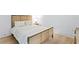 Cozy bedroom with a woven headboard, hardwood floors, and natural light at 334 11Th Ne Ave, St Petersburg, FL 33701