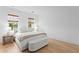 Bright bedroom with wood floors, natural light, and stylish furniture creates a welcoming atmosphere at 334 11Th Ne Ave, St Petersburg, FL 33701