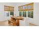 Dining area with wooden table, bench, and natural light from large windows at 334 11Th Ne Ave, St Petersburg, FL 33701