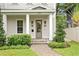 Inviting front porch with decorative lighting and a well-maintained brick walkway at 334 11Th Ne Ave, St Petersburg, FL 33701
