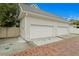 Spacious three-car garage with brick driveway and lush landscaping at 334 11Th Ne Ave, St Petersburg, FL 33701