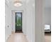 Bright hallway featuring light hardwood floors, white walls and modern lighting at 334 11Th Ne Ave, St Petersburg, FL 33701