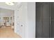 Hallway with white walls, modern black hardware and view of the living room at 334 11Th Ne Ave, St Petersburg, FL 33701