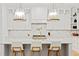 White kitchen with marble island, stainless steel range, and custom lighting at 334 11Th Ne Ave, St Petersburg, FL 33701