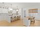 Modern kitchen with marble countertops, white cabinetry, and stainless steel appliances at 334 11Th Ne Ave, St Petersburg, FL 33701