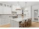 Elegant kitchen with large island, marble countertops and designer light fixtures at 334 11Th Ne Ave, St Petersburg, FL 33701
