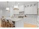 Spacious white kitchen with marble countertops, an island, and stainless steel appliances at 334 11Th Ne Ave, St Petersburg, FL 33701