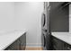 Convenient laundry room featuring a stacked washer and dryer and plenty of storage at 334 11Th Ne Ave, St Petersburg, FL 33701