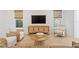 Spacious living room featuring a media console and light wood floors at 334 11Th Ne Ave, St Petersburg, FL 33701