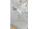Close up of modern glass-enclosed shower, featuring a rain shower head and marble tile at 334 11Th Ne Ave, St Petersburg, FL 33701