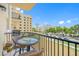 Relaxing balcony with wicker furniture overlooking lush landscaping and city views at 340 1St N St # I, St Petersburg, FL 33701
