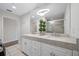 Bathroom featuring double sinks, a large mirror, and a glass-enclosed shower, exuding luxury and comfort at 340 1St N St # I, St Petersburg, FL 33701