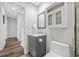 Bathroom with a mirror, gray vanity, drawers and updated features at 340 1St N St # I, St Petersburg, FL 33701