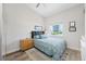 Bright bedroom featuring neutral walls, a patterned rug and a comfortable bed at 340 1St N St # I, St Petersburg, FL 33701