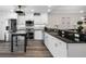 Well-lit kitchen featuring stainless steel appliances, granite countertops, and bright white cabinets at 340 1St N St # I, St Petersburg, FL 33701
