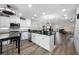 Open floor plan showing modern kitchen with stainless appliances and breakfast bar at 340 1St N St # I, St Petersburg, FL 33701
