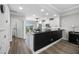 Bright kitchen area with white cabinetry, black granite countertops, and stainless appliances at 340 1St N St # I, St Petersburg, FL 33701