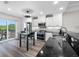 Modern kitchen with white cabinets, stainless steel appliances, and balcony access at 340 1St N St # I, St Petersburg, FL 33701