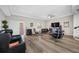 Bright living room with modern furniture, hardwood floors, and a view to the outside at 340 1St N St # I, St Petersburg, FL 33701
