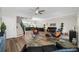 Open-concept living area with a connecting dining and kitchen area, staircase, modern decor, and hardwood floors at 340 1St N St # I, St Petersburg, FL 33701