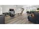Open-concept living room featuring modern design, sleek furnishings, and wood flooring at 340 1St N St # I, St Petersburg, FL 33701