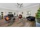 Stylish living room with a variety of seating options, natural light, and hardwood floors at 340 1St N St # I, St Petersburg, FL 33701