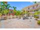 Beautiful patio with brick pavers, lush palm trees, and outdoor seating area at 340 1St N St # I, St Petersburg, FL 33701