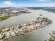 Aerial view of waterfront homes and waterways, showing off the amazing coastal lifestyle and community at 352 La Hacienda Dr, Indian Rocks Beach, FL 33785