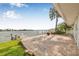 Spacious waterfront backyard with patio and lush landscaping, a perfect outdoor oasis at 352 La Hacienda Dr, Indian Rocks Beach, FL 33785