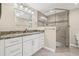 Beautiful bathroom features double sinks, a walk in shower and updated fixtures at 352 La Hacienda Dr, Indian Rocks Beach, FL 33785