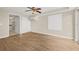 Large bedroom with wood floors, ceiling fan, and closet with sliding doors at 352 La Hacienda Dr, Indian Rocks Beach, FL 33785