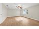 Spacious bedroom showcasing light wood floors, a ceiling fan and large windows at 352 La Hacienda Dr, Indian Rocks Beach, FL 33785
