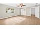The bedroom is light and bright with a ceiling fan, wood floors, and ensuite access at 352 La Hacienda Dr, Indian Rocks Beach, FL 33785