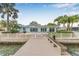 Exterior view of waterfront home with dock and patio, perfect for enjoying the water view at 352 La Hacienda Dr, Indian Rocks Beach, FL 33785