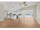 Open concept kitchen with white cabinets, island, and view of the water at 352 La Hacienda Dr, Indian Rocks Beach, FL 33785